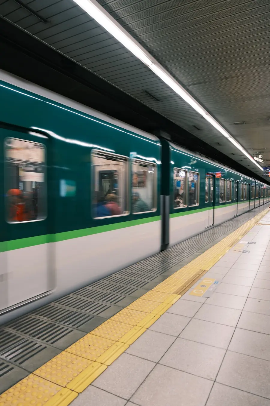 Train arriving at an underground station platform in Kyoto